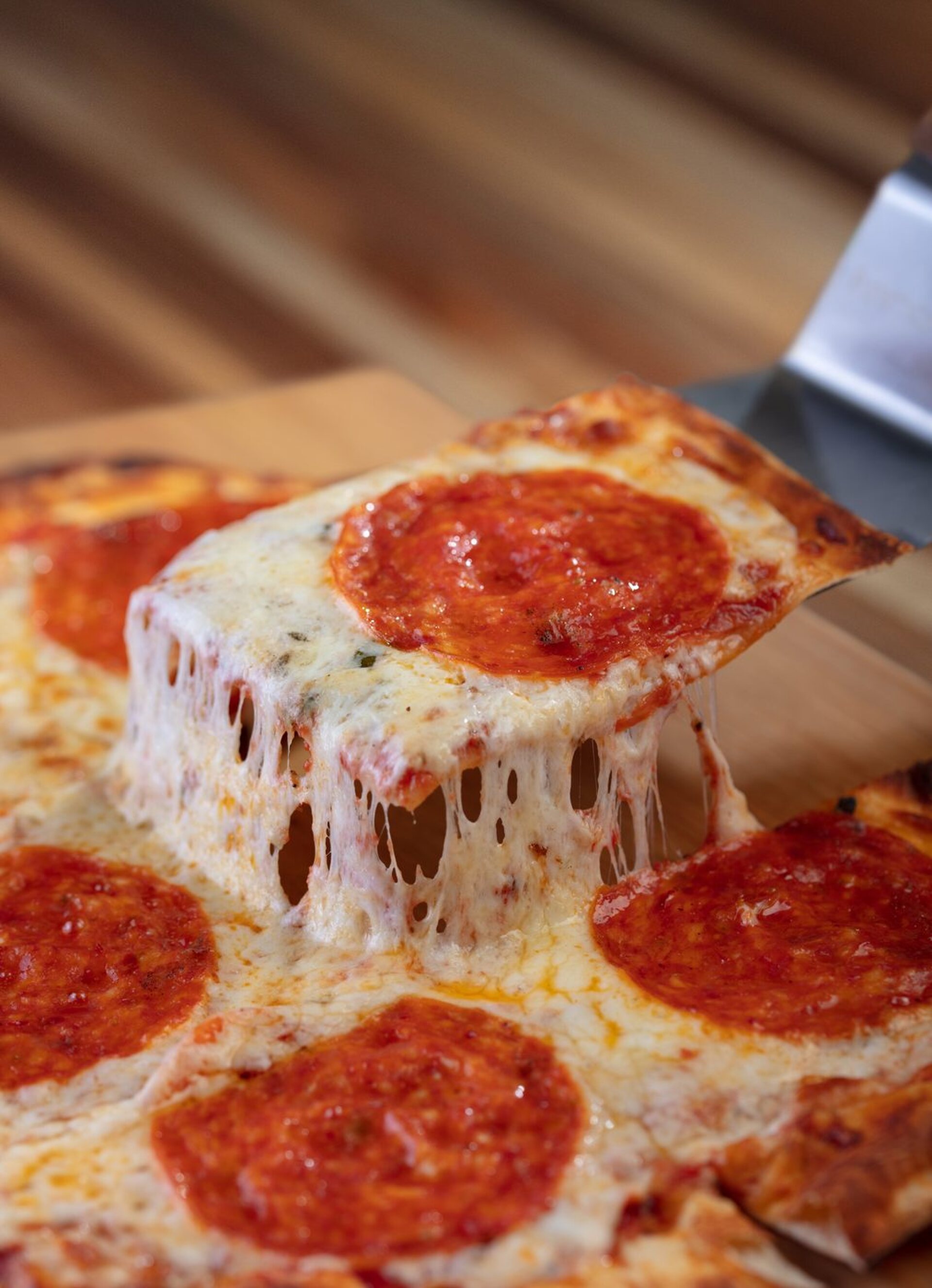Cheese pull on Uncle's pepperoni pizza