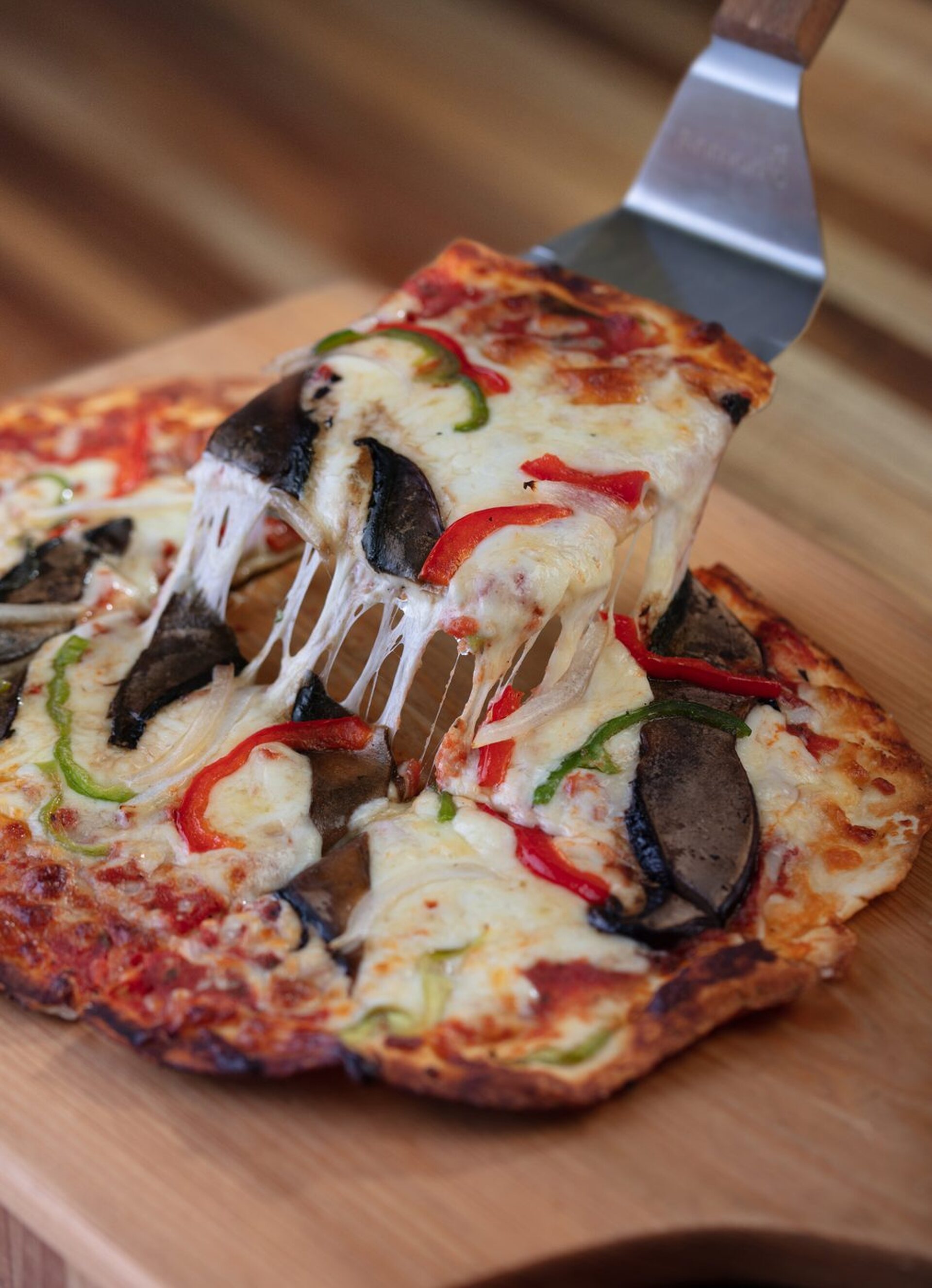 Cheese pull on Uncle's veggie pizza